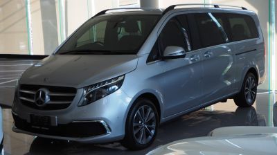 Silver minivan with sleek front end and alloy wheels