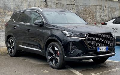 Black SUV with sharp headlights and a distinctive front grille