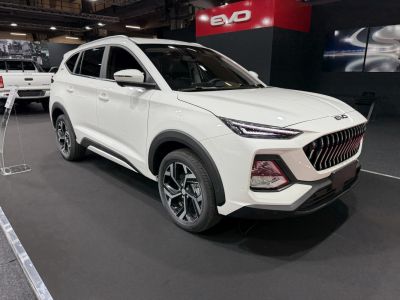 White SUV with prominent front grille and sharp LED headlights
