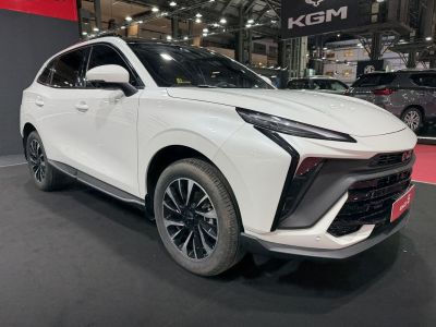 Sleek front grille and sharp modern headlights on a white SUV