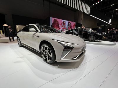 Front side angled view featuring LED headlights and sleek aerodynamic sedan design