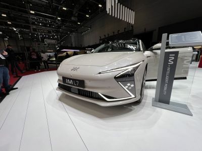 Sleek front fascia with sharp LED headlights and white glossy paint