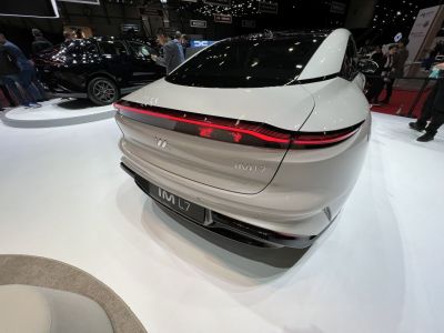 Rear view with full-width LED tail light bar and aerodynamic design