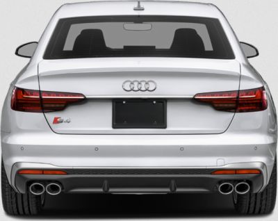 Rear view with distinct tail lights and quad exhaust pipes