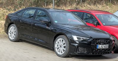 Front side view with LED headlights and hexagonal grille