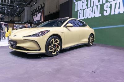 Aerodynamic front design and distinctive multi-spoke wheels on electric sedan