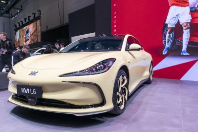 Front view with sleek headlights and uniquely styled alloy wheels