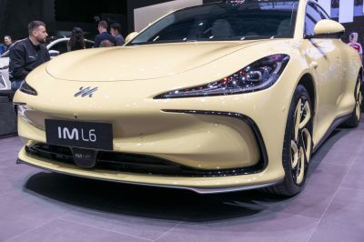 Sleek LED headlights and aerodynamic front design of a yellow vehicle