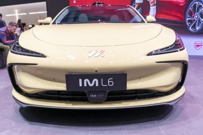 Close-up of a sleek aerodynamic front with modern headlights.