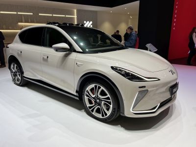 Sleek aerodynamic electric SUV with LED headlights and distinctive alloy wheels.