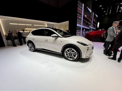 Modern white electric SUV with sleek aerodynamic design