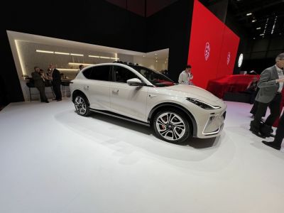 Sleek white electric SUV with LED headlights and unique alloy wheels.