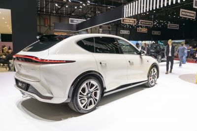 Sleek rear and side profile with aerodynamic contours and alloy wheels