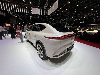 Sleek white SUV rear with continuous LED tail light and smooth body contour