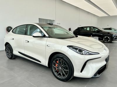 Sleek white electric crossover with aerodynamic front and alloy wheels