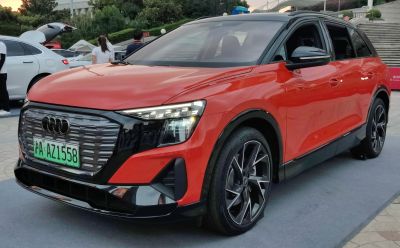 Front view with LED headlights and unique grille of an electric SUV.