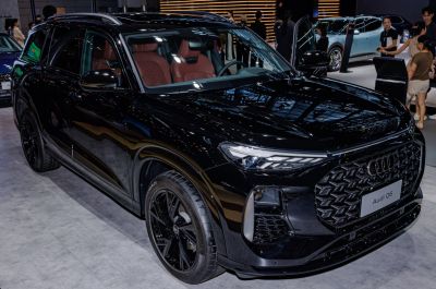 Black luxury SUV with LED headlights and brown leather interior