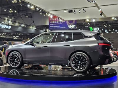 Side profile of sleek electric SUV with modern wheels and sharp design lines
