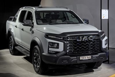 Modern double cab pickup with bold front grille and LED headlights