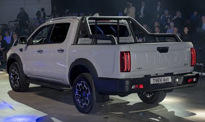 Rear and side view of 4x4 double cab with tail lights and roll bar