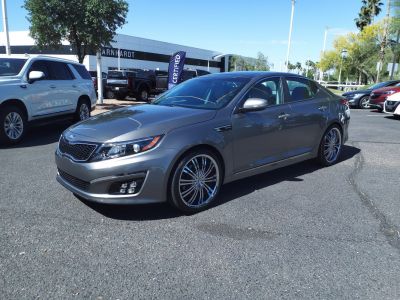 Sleek silver sedan with modern headlights and distinctive alloy wheels.