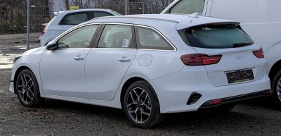 White estate car rear side with modern taillights and alloy wheels