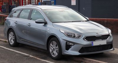 Front and side view of a compact estate car with roof rails and alloy wheels
