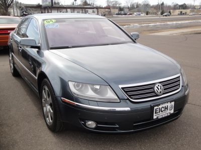 Front view of a luxury sedan with chrome grille and dual headlights