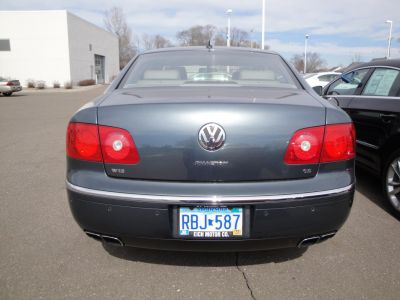 Rear view of luxury sedan tail lights and dual exhaust