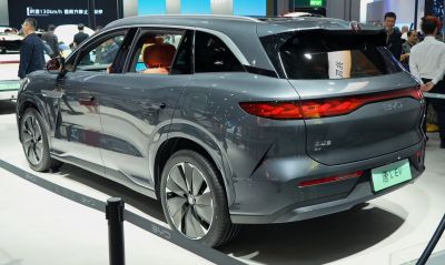 Rear of electric SUV with sleek taillights and alloy wheels.