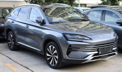 Front view of a modern SUV with sleek LED headlights and futuristic grille design