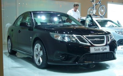 Black sedan with modern headlights and distinctive front grille