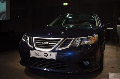 Close-up of front grille, headlights, and fog light on a dark vehicle