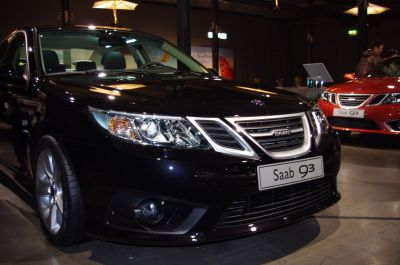 Front close-up of a car with distinct headlights and grille.