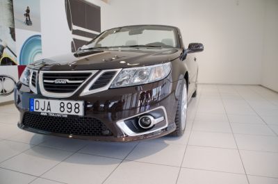Front end with headlights, fog lights, and grille