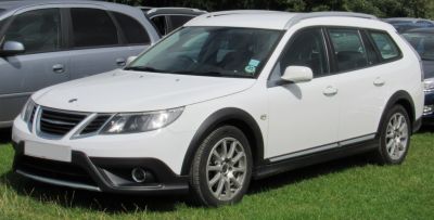 Rugged white station wagon with roof rails and alloy wheels