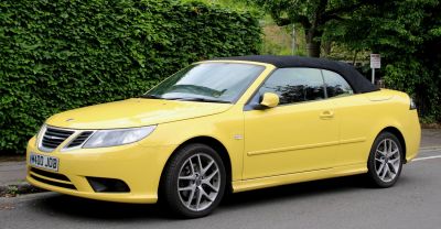 Yellow convertible with front grille and alloy wheels