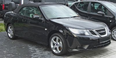 Black convertible with soft top and alloy wheels