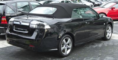 Black convertible with soft top and alloy wheels