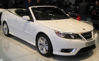 White convertible showing front and side profiles with alloy wheels