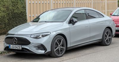 Sleek front design with modern alloy wheels on electric luxury sedan