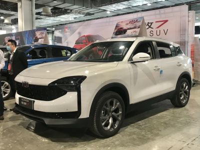 Front and side view of a white modern SUV with bold grille and sleek design