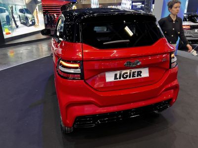 Rear view with sleek taillights and two-tone paint on compact vehicle