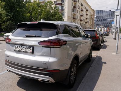 Rear view of SUV with LED taillights and roof spoiler