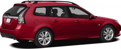 Red station wagon with roof rails and alloy wheels side view