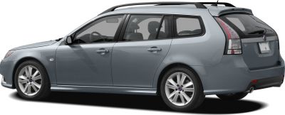 Side view of a grey station wagon with alloy wheels and roof rails