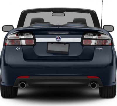 Rear view of a convertible showing taillights, dual exhaust, and badge details