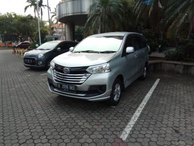 Silver MPV with chrome grille and sleek headlights