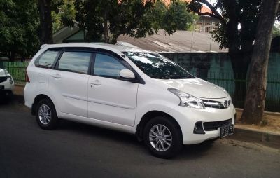 White multi-purpose vehicle side view with alloy wheels