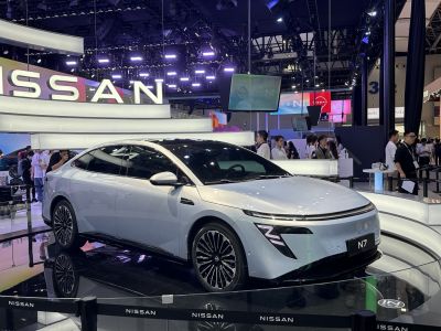 Sleek electric sedan with aerodynamic body and distinctive Z-shaped LED front headlights.
